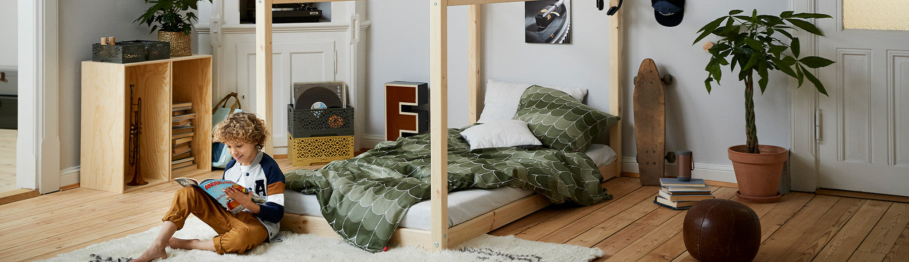 Boy in his room with a cottage single bed from FLEXA