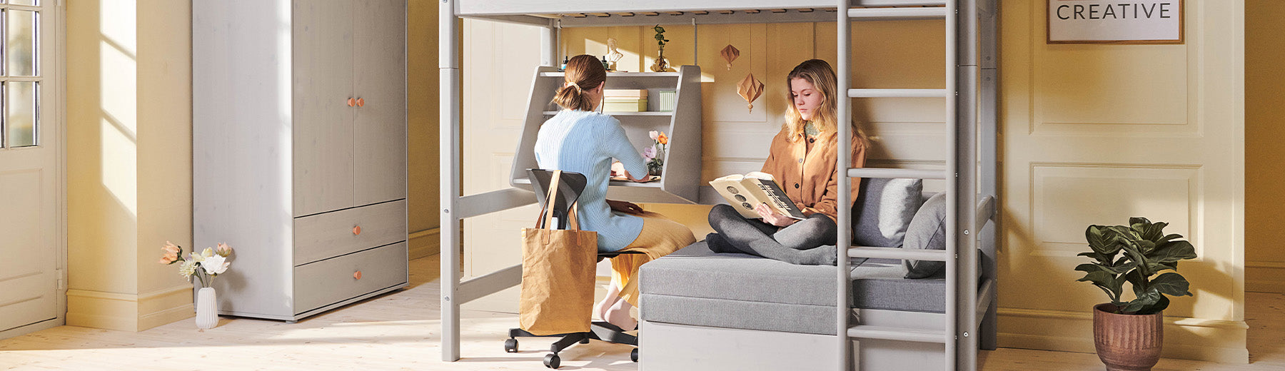 Girls are hanging out at their high bed desk from FLEXA