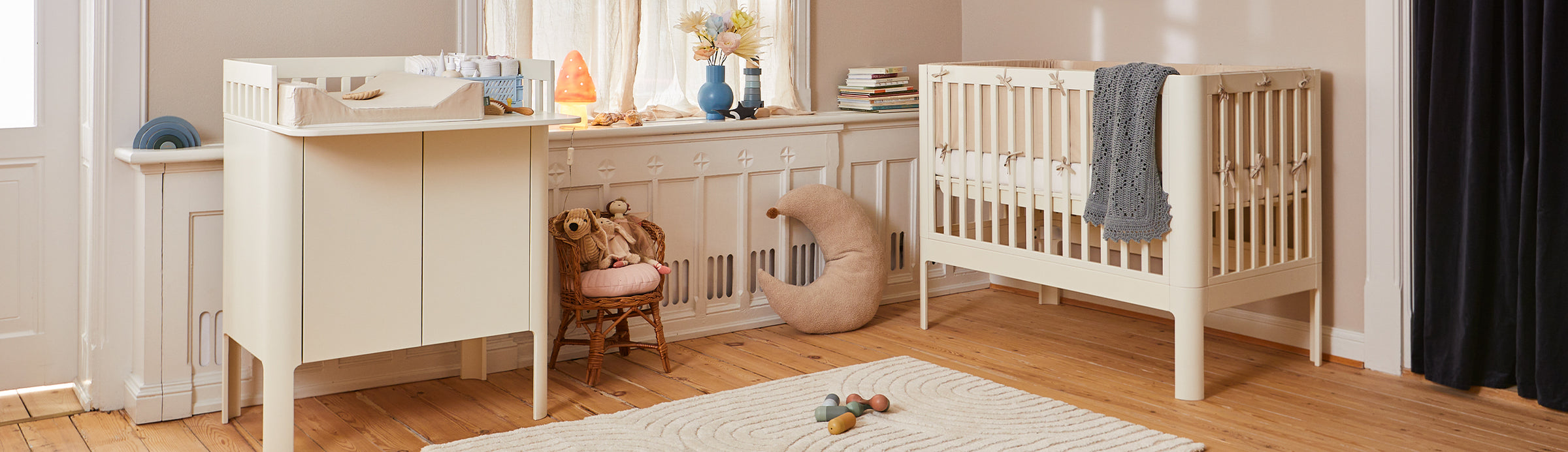 Baby room with a cot bed and changing table from FLEXA