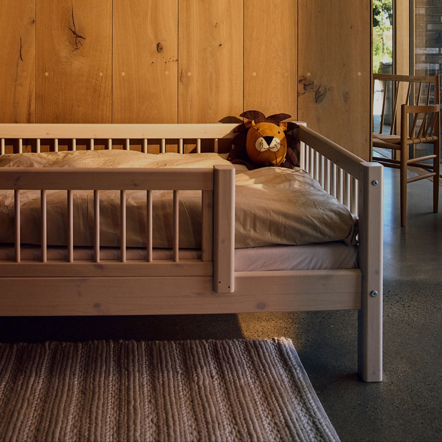 Boy playing in his room with a Classic mid-high bed from FLEXA
