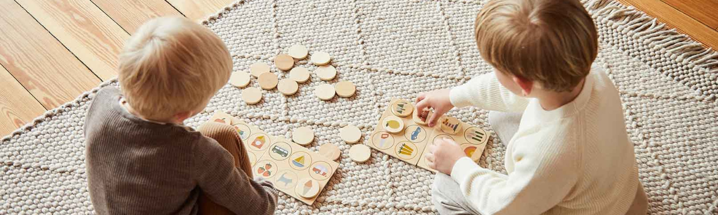 Child playing with wooden cognitive toys from FLEXA