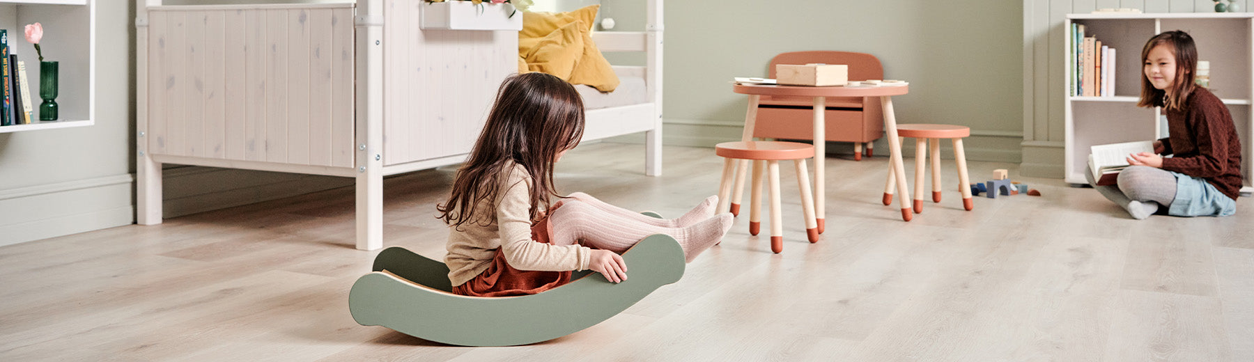 Girls playing with FLEXA motor play toys