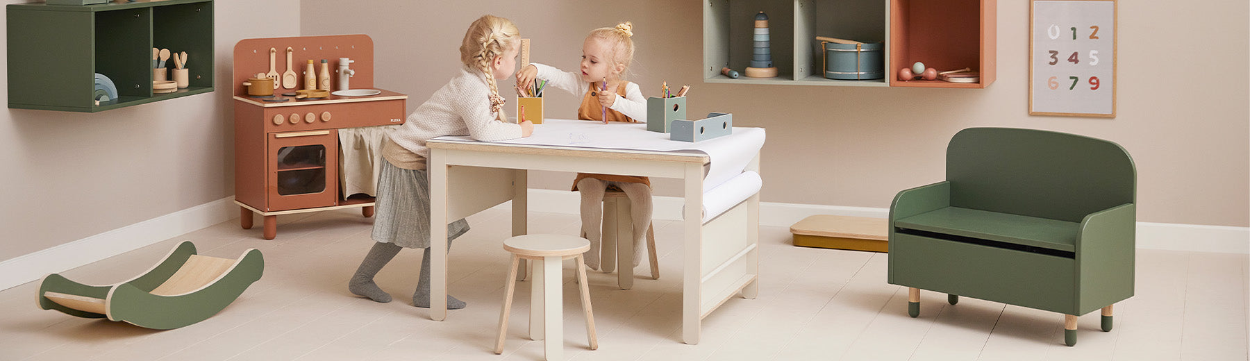 Girls playing with creative table and toys from FLEXA