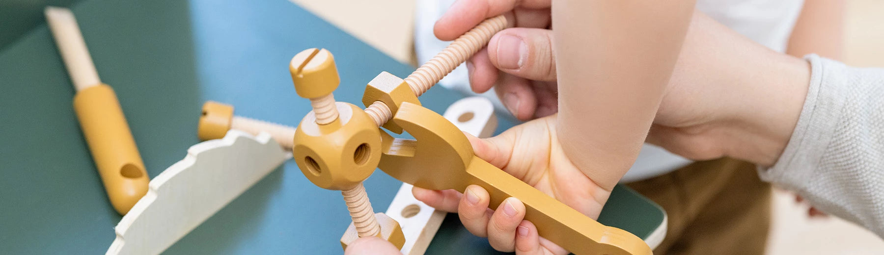 children playing with wooden construction toys from FLEXA