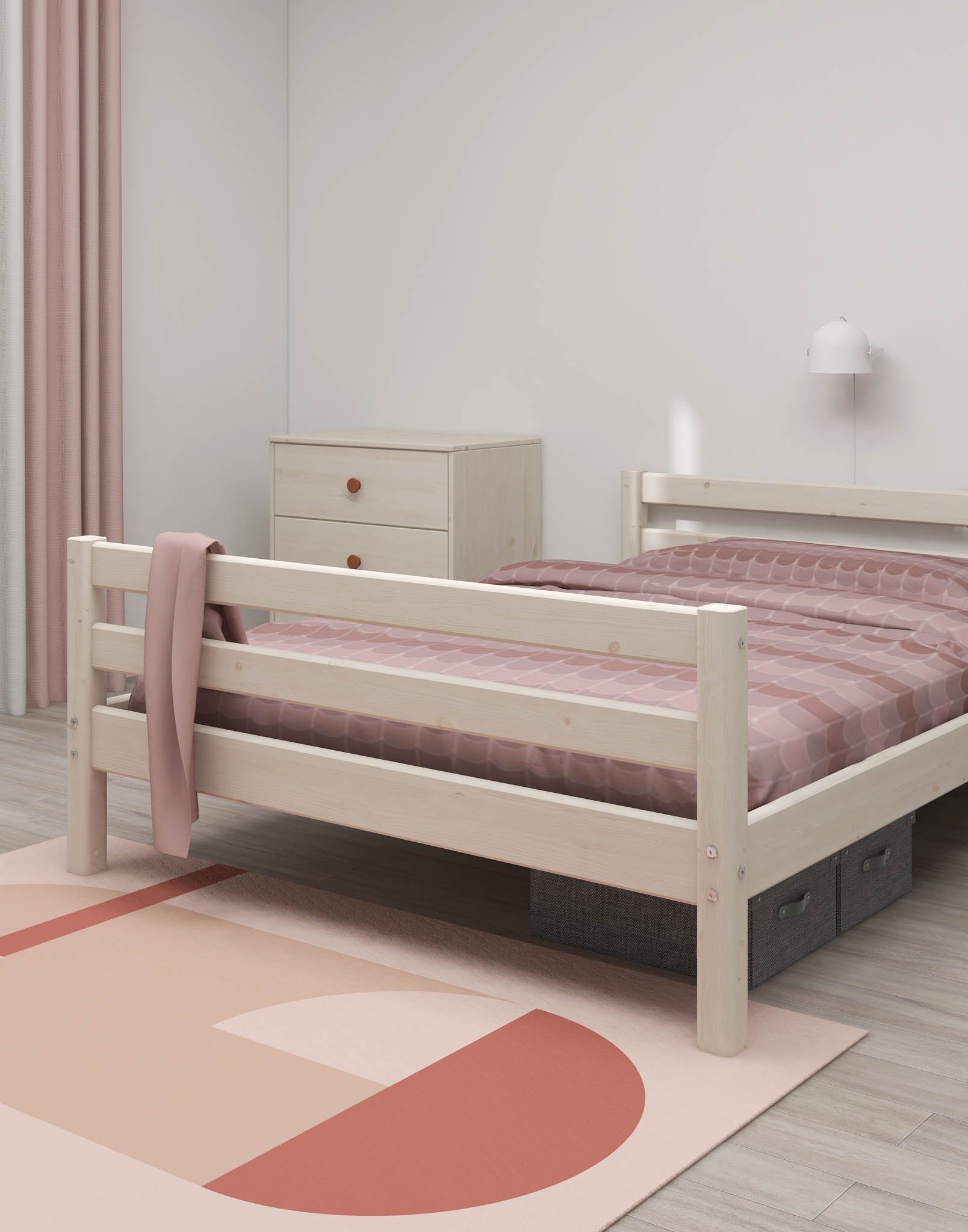 FLEXA single white bed from CLASSIC collection in a minimalist child’s room with pink bedding, dresser, and rug.
