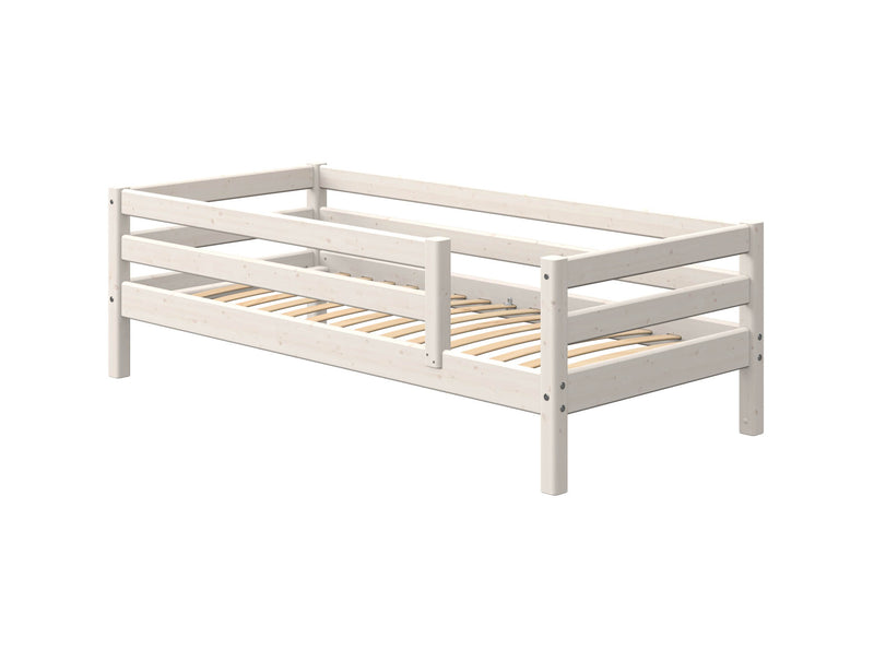 Single bed with safety rail