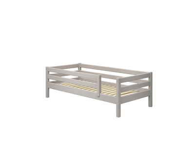 Single bed with safety rail