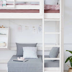 FLEXA HIGH BED in white with sofa, desk, ladder and safety rail; child-safe; shown in children’s bedroom setting.