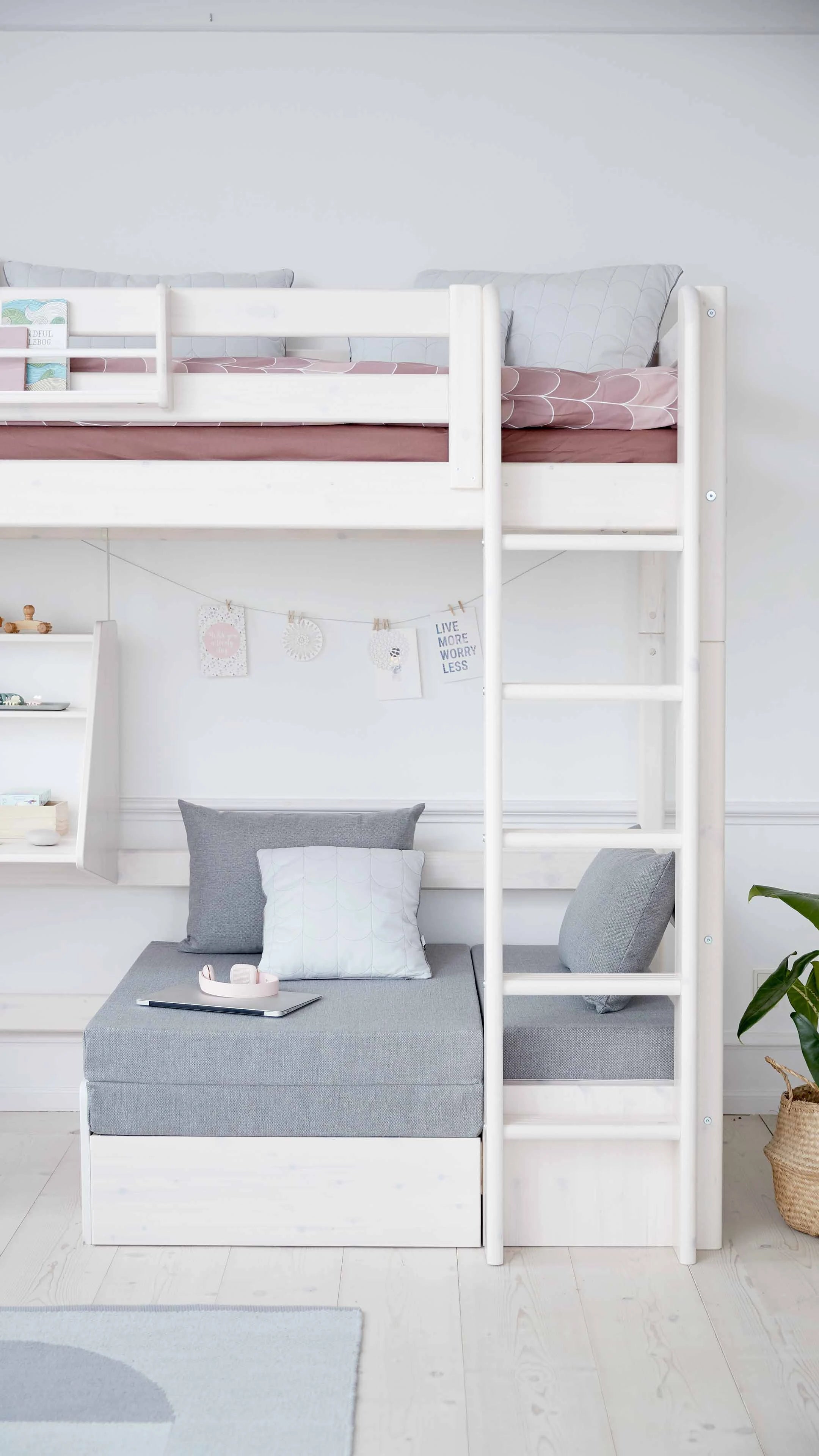 FLEXA HIGH BED in white with sofa, desk, ladder and safety rail; child-safe; shown in children’s bedroom setting.