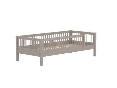 Single bed with safety rail