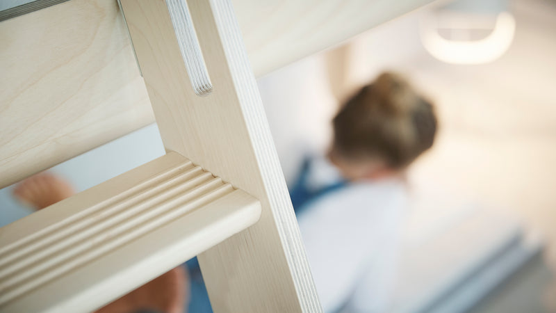 Mid-high bed with slanting ladder