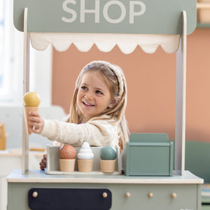 Girl playing with Wooden Ice Cream Set and Play Shop from FLEXA