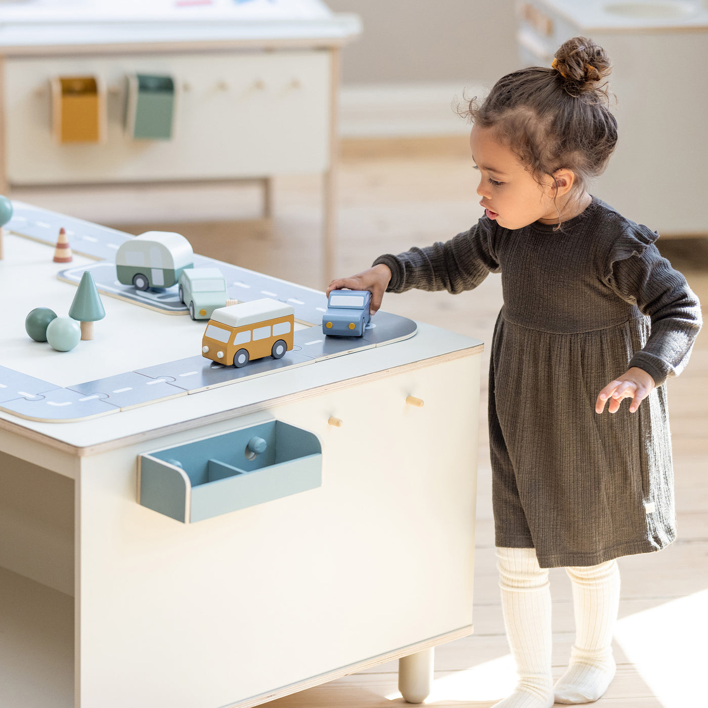 Wooden cars and car tracks from FLEXA on play table