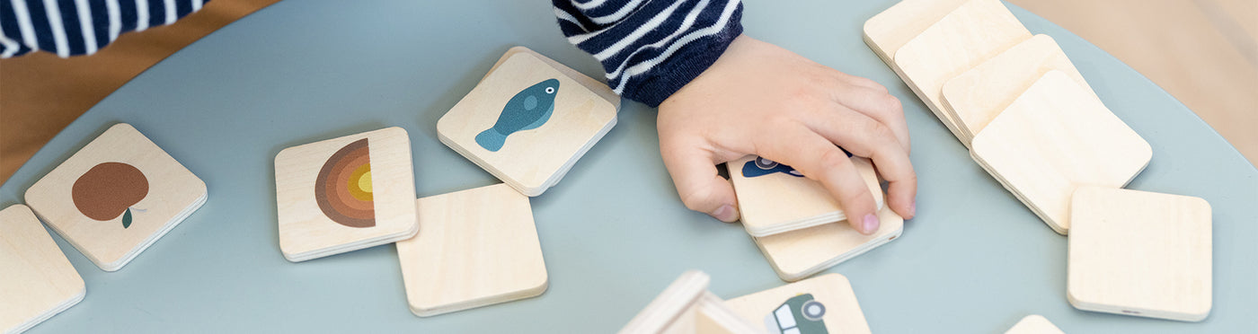 Boy Playing with Wooden Memory Game from FLEXA 