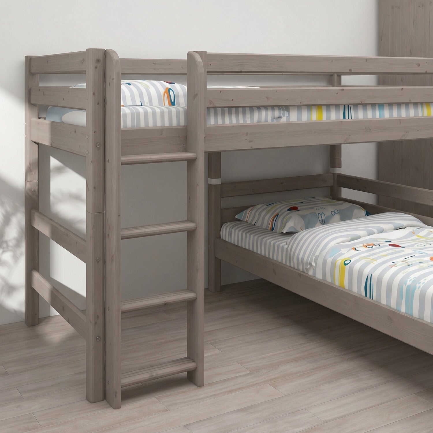 FLEXA semi-high bed from CLASSIC collection with straight ladder, striped bedding, light wood, in a bright child’s room.